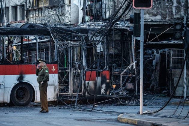 Santiago, July 14, 2026: A traffic accident involving a Red Eléctrico bus and a private vehicle at the corner of Santa Rosa and Franklin in the city of Santiago caused a fire in commercial establishments at that intersection. Diego Martin Aton Chile, Aton 1172296 jpeg  Copyright: DIEGOxMARTIN ATONxCHILE