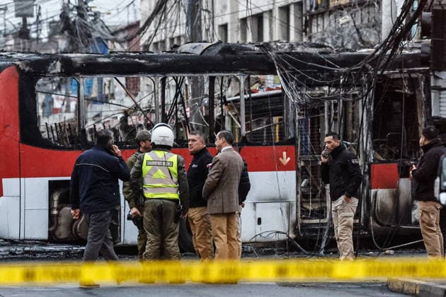 Santiago, July 14, 2026: A traffic accident involving a Red Eléctrico bus and a private vehicle at the corner of Santa Rosa and Franklin in the city of Santiago caused a fire in commercial establishments at that intersection. Diego Martin Aton Chile, Aton 1172301 jpeg  Copyright: DIEGOxMARTIN ATONxCHILE