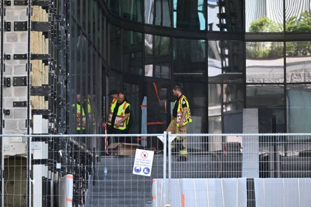 the scene of a fire at the OXY building at place De Brouckere, in Brussels, Tuesday 14 July 2026s. The Brussels Labour Inspectorate confirms several bodies were found in the lift shafts, 6 people are still missing. The fire broke out on the second floor of the building that is currently being renovated.  EMILExWINDAL 181118338