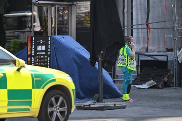 the scene of a fire at the OXY building at place De Brouckere, in Brussels, Tuesday 14 July 2026s. The Brussels Labour Inspectorate confirms several bodies were found in the lift shafts, 6 people are still missing. The fire broke out on the second floor of the building that is currently being renovated.  EMILExWINDAL 181118346