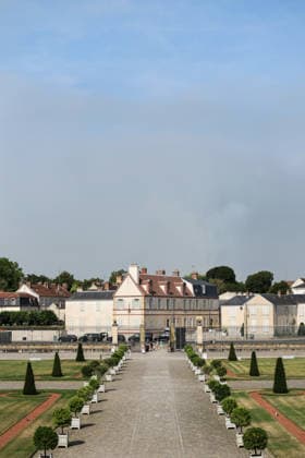 (260714) -- SEINE-ET-MARNE, July 14, 2026 -- This photo taken on July 14, 2026 shows the Palace of Fontainebleau in Seine-et-Marne, France, with smoke from a wildfire rising in the distance. French police have detained 59 people across the country in connection with wildfires, including two suspects linked to the blaze in the Fontainebleau forest in Seine-et-Marne department, southeast of Paris, French Interior Minister Laurent Nunez said on Monday. The wildfire in the Fontainebleau forest broke out on Sunday evening and continued to spread on Monday. ) FRANCE-SEINE-ET-MARNE-FONTAINEBLEAU-WILDFIRE WuxHuiwo 