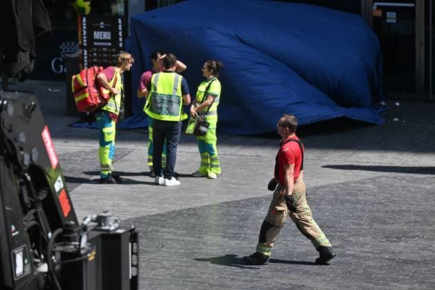 the scene of a fire at the OXY building at place De Brouckere, in Brussels, Tuesday 14 July 2026s. The Brussels Labour Inspectorate confirms several bodies were found in the lift shafts, 6 people are still missing. The fire broke out on the second floor of the building that is currently being renovated.  EMILExWINDAL 181122349