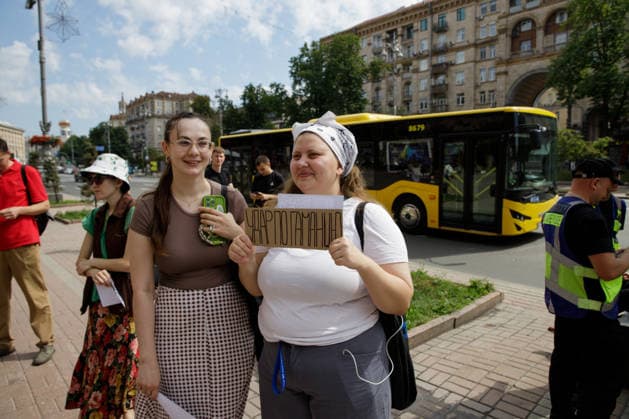 Demonstrators protest against the increase in municipal transport fares during the Preserve Affordable Transport in Kyiv rally outside the Kyiv City State Administration building, Kyiv, Ukraine, July 14, 2026. The capital plans to raise the fare for municipal transport to UAH 30 per single trip. The new tariffs will take effect from July 15, 2026. (Photo by Marianna Kotyk Ukrinform) Kyivans protest against municipal transport fare hike  Copyright: xMariannaxKotykx