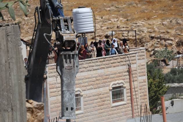Israeli Forces Demolish Palestinian Home South of Hebron AL-DEIRAT, WEST BANK JULY 14, 2026: Israeli forces demolished the home of Palestinian resident Osama Masaaf in the village of Al-Deirat, south of Hebron, in the occupied West Bank, on July 14, 2026, displacing a family of eight. Israeli authorities said the house was demolished for being built without an Israeli-issued permit. Hebron Palestine, State of Copyright: x xMosabxshawerx xJNAxPressx
