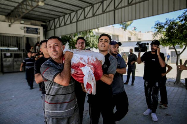 Four Palestinians killed in Israeli strike near Jabalia refugee camp GAZA CITY, GAZA PALESTINE - JULY 14: (EDITOR S NOTE: Image depicts graphic content) Bodies of four Palestinians, including a woman, are brought to Al-Shifa Hospital after an Israeli strike on a police post west of the Jabalia refugee camp despite the ceasefire in Gaza City, Gaza, Palestine, on July 14, 2026. Saeed M. M. T. Jaras Anadolu Gaza City Gaza. Editorial use only. Please get in touch for any other usage.  Copyright: x2026xAnadoluxSaeedxM.xM.xT.xJarasx