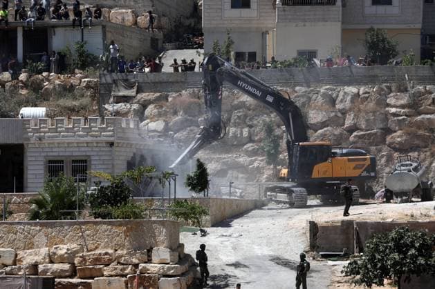 (260714) -- HEBRON, July 14, 2026 -- An Israeli excavator demolishes a Palestinian house in the village of Deirat, east of Yatta, the West Bank, on July 14, 2026. (Photo by Xinhua) MIDEAST-WEST BANK-HEBRON-DEMOLITION MamounxWazwaz 