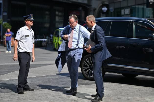 Prime Minister Bart de Wever and pictured at the scene of a fire at the OXY building at place De Brouckere, in Brussels, Tuesday 14 July 2026s. The Brussels Labour Inspectorate confirms several bodies were found in the lift shafts, 6 people are still missing. The fire broke out on the second floor of the building that is currently being renovated.  EMILExWINDAL 181129474