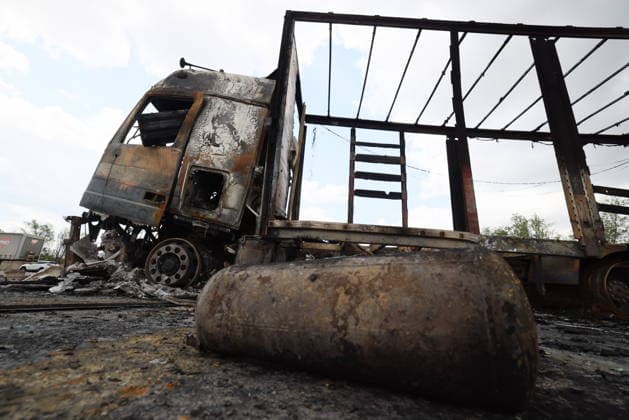 RUSSIA, LUGANSK - JULY 14, 2026: A destroyed vehicle is seen after a military strike on a parking lot with civilian trucks. Alexander Reka TASS  95028619