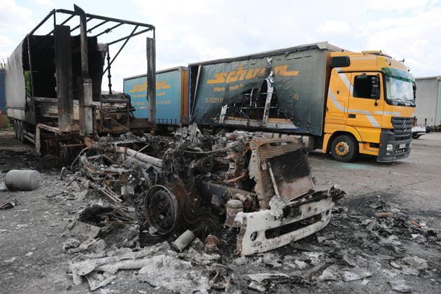 RUSSIA, LUGANSK - JULY 14, 2026: Destroyed vehicles are seen after a military strike on a parking lot with civilian trucks. Alexander Reka TASS  95028629