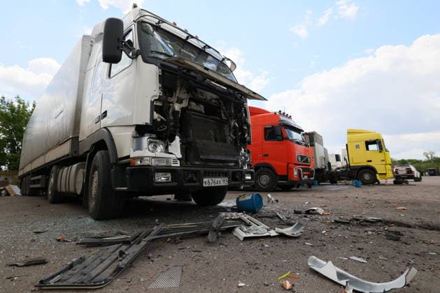 RUSSIA, LUGANSK - JULY 14, 2026: Destroyed vehicles are seen after a military strike on a parking lot with civilian trucks. Alexander Reka TASS  95028647