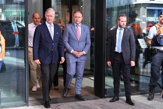 King Philippe - Filip of Belgium and Prime Minister Bart de Wever pictured at the scene of a fire at the OXY building at place De Brouckere, in Brussels, Tuesday 14 July 2026s. The Brussels Labour Inspectorate confirms several bodies were found in the lift shafts, 6 people are still missing. The fire broke out on the second floor of the building that is currently being renovated.  EMILExWINDAL 181131475