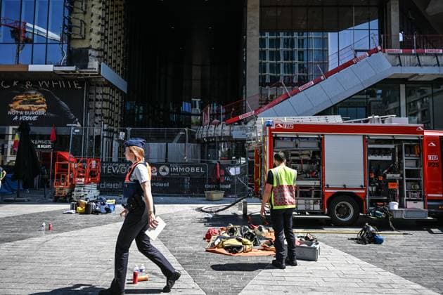(260714) -- BRUSSELS, July 14, 2026 -- This photo taken on July 14, 2026 shows the fire site of the Oxy building on De Brouckere Square, Brussels, Belgium. Multiple people have died on Tuesday in a fire at the well-known Oxy building on De Brouckere Square, in the center of Brussels. According to local media, 6 people are still missing. The fire brigade has deployed en masse for a major search and rescue operation. ) (SpotNews) BELGIUM-BRUSSELS-BUILDING-FIRE PengxZiyang 