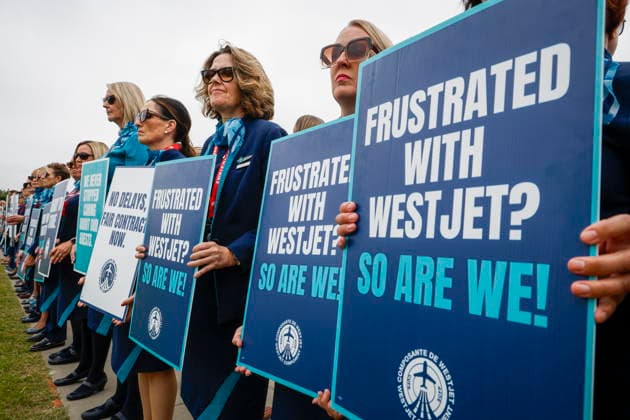 July 14, 2026, Calgary, Ab, CANADA: WestJet flight attendants hold a Day of Action while union members vote on a possible strike in Calgary, Tuesday, July 14, 2026. Calgary CANADA  - ZUMAc35_ 20260714_zaf_c35_043 Copyright: xJeffxMcintoshx