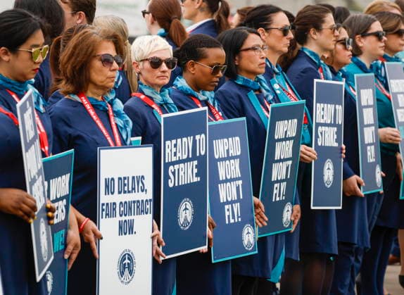 July 14, 2026, Calgary, Ab, CANADA: WestJet flight attendants hold a Day of Action while union members vote on a possible strike in Calgary, Tuesday, July 14, 2026. Calgary CANADA  - ZUMAc35_ 20260714_zaf_c35_044 Copyright: xJeffxMcintoshx