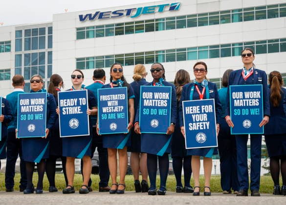July 14, 2026, Calgary, Ab, CANADA: WestJet flight attendants hold a Day of Action while union members vote on a possible strike in Calgary, Tuesday, July 14, 2026. Calgary CANADA  - ZUMAc35_ 20260714_zaf_c35_045 Copyright: xJeffxMcintoshx
