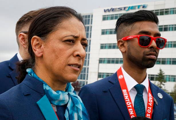 July 14, 2026, Calgary, Ab, CANADA: Alia Hussain, left, President of CUPE Local 8125, speaks to the media as WestJet flight attendants hold a Day of Action while union members vote on a possible strike in Calgary, Tuesday, July 14, 2026. Calgary CANADA  - ZUMAc35_ 20260714_zaf_c35_047 Copyright: xJeffxMcintoshx