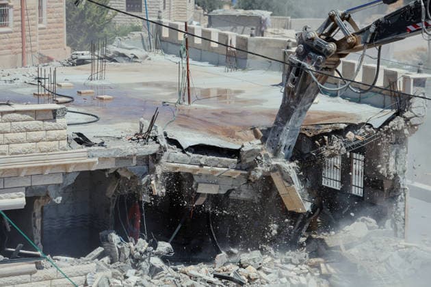 Hebron West Bank Home Demolition An excavator operates during a home demolition in Al-Deirat, south of Hebron, occupied West Bank on July 14, 2026. Israeli forces demolish the home of Osama Masaaf on the grounds that it lacked an Israeli-issued building permit, displacing a Palestinian family of eight. Hebron West Bank Palestinian Territories Copyright: xMosabxShawerx