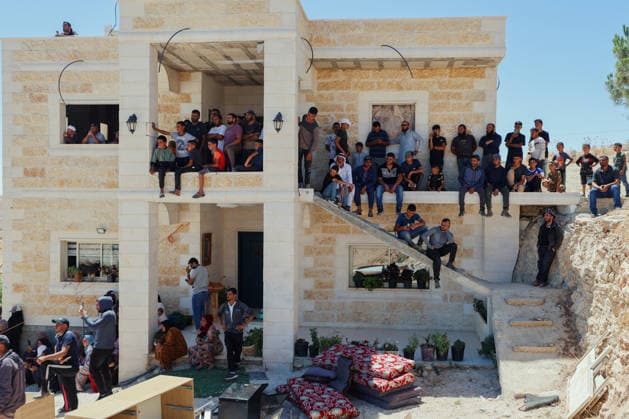 Hebron West Bank Home Demolition Palestinian residents gather outside a home during an Israeli demolition operation in Al-Deirat, south of Hebron, occupied West Bank on July 14, 2026. Israeli forces demolish the home of Osama Masaaf on the grounds that it lacked an Israeli-issued building permit, displacing a Palestinian family of eight. Hebron West Bank Palestinian Territories Copyright: xMosabxShawerx