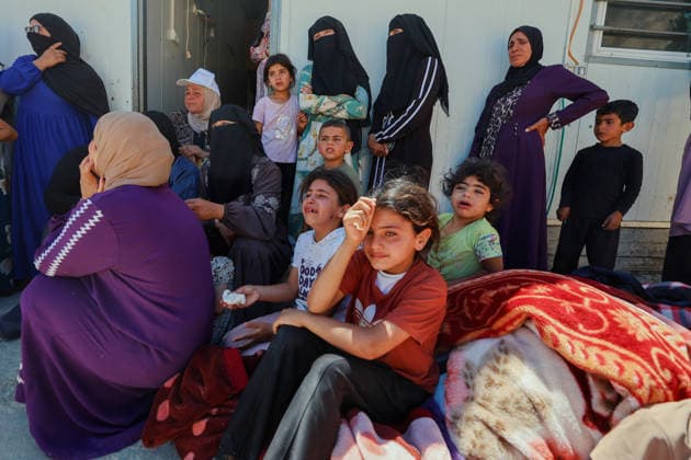 Hebron West Bank Home Demolition Palestinian women and children gather outside a home during an Israeli demolition operation in Al-Deirat, south of Hebron, occupied West Bank on July 14, 2026. Israeli forces demolish the home of Osama Masaaf on the grounds that it lacked an Israeli-issued building permit, displacing a Palestinian family of eight. Hebron West Bank Palestinian Territories Copyright: xMosabxShawerx