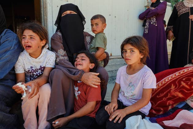 Hebron West Bank Home Demolition Palestinian women and children gather outside a home during an Israeli demolition operation in Al-Deirat, south of Hebron, occupied West Bank on July 14, 2026. Israeli forces demolish the home of Osama Masaaf on the grounds that it lacked an Israeli-issued building permit, displacing a Palestinian family of eight. Hebron West Bank Palestinian Territories Copyright: xMosabxShawerx