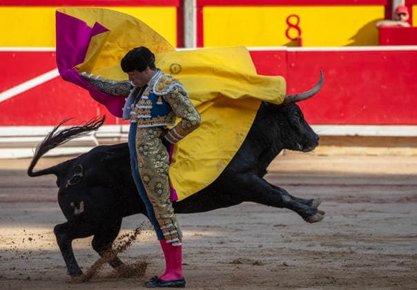 Thomas Rufo performs with a Jandilla fighting bulls during the final bullfight in the Fiesta de San Fermin and Feria del Toro 2026 in Pamplona, northern Spain, on July 14, 2026. Rufo cut four ears on his two bulls and was carried out from the bullring on shoulders. The renowned festival ends at midnight today.  PAM20260714152 JimxHollander