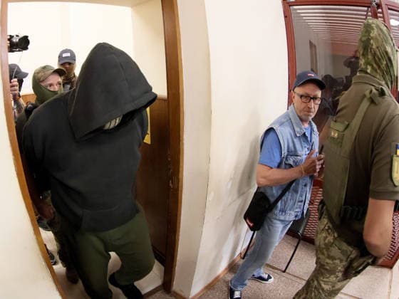 RECORD DATE NOT STATED Court officers escort former Security Service of Ukraine (SBU) officer Vitalii Zhykovych, one of two suspects in the murder case of Anastasiia Berezovska, into the courtroom at the Pecherskyi District Court for a hearing on a preventive measure, Kyiv, Ukraine, on July 9, 2026. The court remanded him in custody for 60 days without the right to post bail. Two people have been detained in connection with the murder investigation: former law enforcement officer Vitalii Zhykovych and serving Defence Intelligence of Ukraine (HUR) officer Vladyslav Reut. Thirty-nine-year-old Ukrainian citizen Anastasiia Berezovska had been placed on an international wanted list in connection with an alleged attempt to arrange the killing of the family of sanctione  Copyright: xPavloxBahmutx