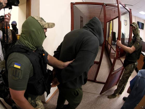 RECORD DATE NOT STATED Court officers escort former Security Service of Ukraine (SBU) officer Vitalii Zhykovych, one of two suspects in the murder case of Anastasiia Berezovska, into the courtroom at the Pecherskyi District Court for a hearing on a preventive measure, Kyiv, Ukraine, on July 9, 2026. The court remanded him in custody for 60 days without the right to post bail. Two people have been detained in connection with the murder investigation: former law enforcement officer Vitalii Zhykovych and serving Defence Intelligence of Ukraine (HUR) officer Vladyslav Reut. Thirty-nine-year-old Ukrainian citizen Anastasiia Berezovska had been placed on an international wanted list in connection with an alleged attempt to arrange the killing of the family of sanctione  Copyright: xPavloxBahmutx
