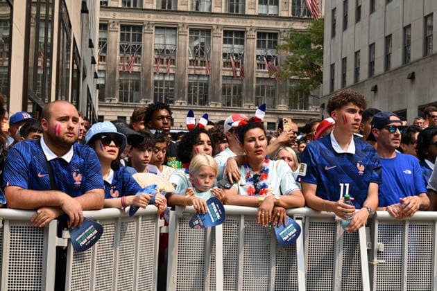 July 14, 2026, New York, New York, USA: July 14, 2026 - New York, NY, USA - New Yorkers and tourists supporting Spain and France in the semi-final match of the World Cup gather in Rockefeller Center for a watch party. Despite the high heat and sun the area was packed. The promising run to the final for France and Mbappe ends with SpainÃ¢â‚¬â ¢s win 2-0. The fans were on the pitch and in the Channel Gardens. (Andrea RENAULT Zuma Press) New York USA  - ZUMAg115 20260714_faf_g115_017 Copyright: xAndreaxRenaultx