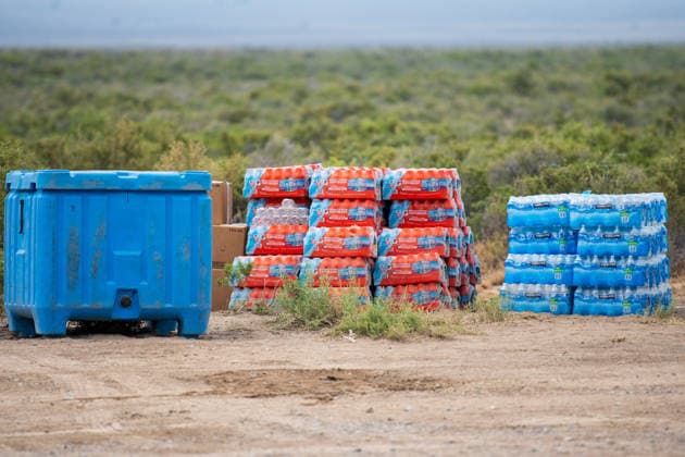 July 14, 2026, Vernon, Utah, USA: Stacks of bottled water and supplies sit at an emergency staging area near Vernon, Utah, on Tuesday, July 14, 2026. Relief provisions are stationed nearby to support personnel responding to the active Stookey wildfire in Tooele County. Vernon USA  - ZUMAm292 20260714_znp_m292_036 Copyright: xCharlesxMcClintockxWilsonx