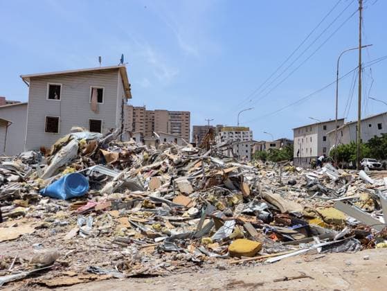 July 14, 2026, La Guaira, Venezuela (Bolivarian Republic of: PLAYA GRANDE, LA GUAIRA, VENEZUELA Ã¢â‚¬ JULY 14, 2026: Excavators and civil carry out controlled demolition and debris removal operations in the coastal community of Playa Grande, one of the areas hardest hit by the earthquake that struck northern Venezuela 20 days earlier. The operations have entered the recovery phase, focusing on clearing major roads blocked by collapsed residential buildings to restore access and mobility for residents as reconstruction efforts continue. JNA Press. La Guaira Venezuela (Bolivarian Republic of  - ZUMAq101 20260714_zna_q101_182 Copyright: xMarioxFloresx