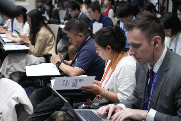 BEIJING, CHINA - JULY 15: Journalists work at a press conference held by the State Council Information Office (SCIO) on China s economic performance in H1 2026 on July 15, 2026 in Beijing, China.  Copyright: xVCGx 111654402436