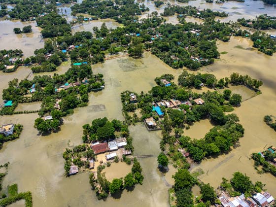 Aftermath Of Floodwaters In Chattogram A drone shot captures clusters of homes isolated like green islands amid massive sheets of standing floodwater in Banshkhali, Chattogram, Bangladesh, on July 14, 2026. Although the flood waters in Banshkhali and Satkania in Chittagong are slowly receding.Many areas are still knee-deep in water, and as the water recedes, collapsed mud houses, damaged structures, destroyed brick kilns and severely damaged agricultural land are becoming visible, displacing thousands of people and leaving them struggling to meet their basic needs. Chattogram Bangladesh  Copyright: xZakirxHossainx originalFilename: hossain-notitle260714_np3ls.jpg