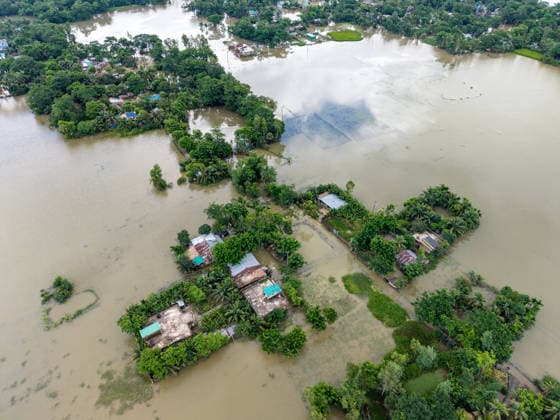 Aftermath Of Floodwaters In Chattogram A high-angle drone shot reveals extensive waterlogging across rural settlements and agricultural land following heavy flash floods in Banshkhali, Chattogram, Bangladesh, on July 14, 2026. Flood waters in Banshkhali and Satkania in Chittagong are slowly receding, revealing collapsed mud houses, damaged structures, destroyed brick kilns and severely damaged agricultural land. The flooding has displaced thousands of people. Chattogram Bangladesh  Copyright: xZakirxHossainx originalFilename: hossain-notitle260714_npDND.jpg