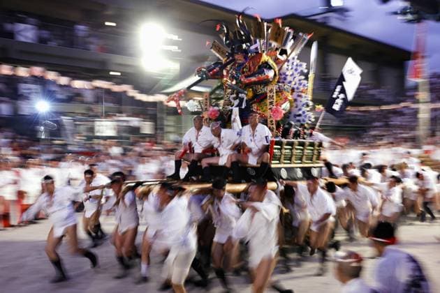 Hakata Gion Yamakasa Festival in Fukuoka People run while carrying a yamakasa decorated float along a 5-kilometer course during the annual Hakata Gion Yamakasa Festival in the early morning of July 15, 2026, in the southwestern Japan city of Fukuoka.  A14AA0005623192P