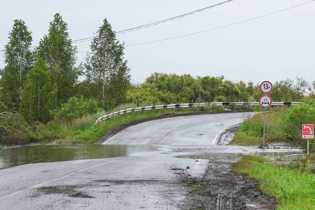 RUSSIA, SVERDLOVSK REGION - JULY 15, 2026: Floodwater reaches a road to the village of Kilachevskoye, southwest of Irbit. Donat Sorokin TASS  95061306