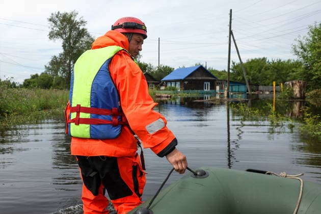 RUSSIA, SVERDLOVSK REGION - JULY 15, 2026: An emergency worker appears with an inflatable boat in the flood-hit village of Zaikovo, southwest of Irbit. Donat Sorokin TASS  95063248