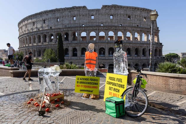 IPA86699878 - Ice Workers flash mob organized by Greenpeace Italy activists near the Colosseum in Rome to mark the European Day for Victims of the Global Climate Crisis  Copyright: xMatteoxNardonex xx 86699878