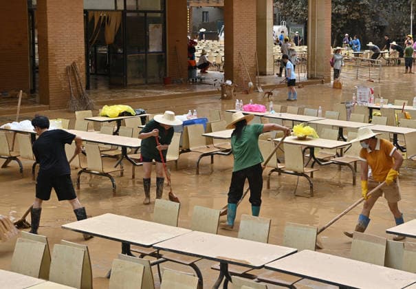 (260715) -- GUIGANG, July 15, 2026 -- People clear mud after flooding at a high school in Guigang, south China s Guangxi Zhuang Autonomous Region, July 15, 2026. Flood relief and recovery efforts were underway after the city was hit by severe rainstorms and flooding caused by Typhoon Maysak. ) CHINA-GUANGXI-GUIGANG-FLOOD-AFTERMATH (CN) LuxBoan 