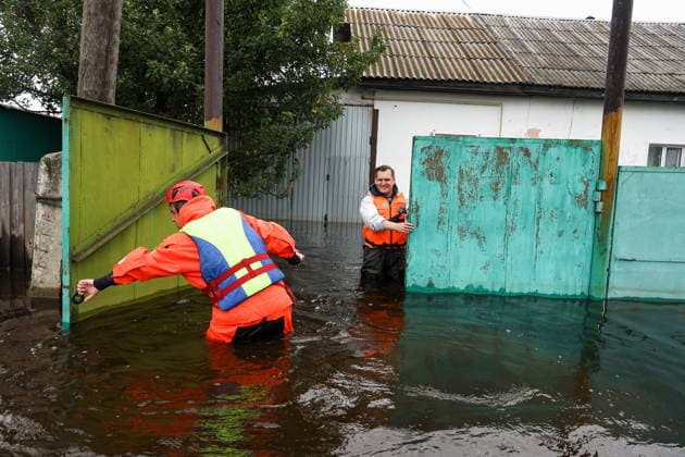 RUSSIA, SVERDLOVSK REGION - JULY 15, 2026: Emergency worker respond to flooding in the village of Zaikovo, southwest of Irbit. Donat Sorokin TASS  95063649