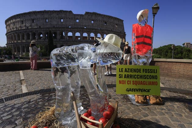 Greenpeace action on impact of global warming on workers in Italy ROME, ITALY, JULY 15: Ice statues representing a farm worker, a construction worker and a food delivery rider stand in front of the Colosseum after being placed by Greenpeace activists to melt under the sun during an awareness campaign highlighting the impact of global warming on workers, as a new heatwave grips in Rome, Italy on July 15, 2026. Seven cities were placed under a red alert on Wednesday, with the number expected to rise on Thursday, July 16, and temperatures forecast to exceed 40 degrees Celsius in many areas. Riccardo De Luca Anadolu Rome Italy. Editorial use only. Please get in touch for any other usage.  Copyright: x2026xAnadoluxRiccardoxDexLucax