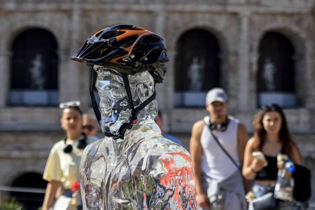 Greenpeace action on impact of global warming on workers in Italy ROME, ITALY, JULY 15: Ice statues representing a farm worker, a construction worker and a food delivery rider stand in front of the Colosseum after being placed by Greenpeace activists to melt under the sun during an awareness campaign highlighting the impact of global warming on workers, as a new heatwave grips in Rome, Italy on July 15, 2026. Seven cities were placed under a red alert on Wednesday, with the number expected to rise on Thursday, July 16, and temperatures forecast to exceed 40 degrees Celsius in many areas. Riccardo De Luca Anadolu Rome Italy. Editorial use only. Please get in touch for any other usage.  Copyright: x2026xAnadoluxRiccardoxDexLucax