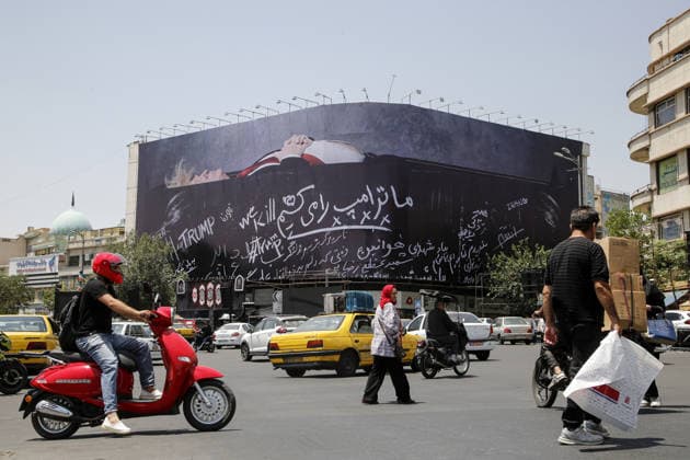 Giant billboard depicting Donald Trump hung in Tehran s Revolution Square TEHRAN, IRAN - JULY 15 : A view of a billboard depicting US President Donald Trump lying in a black coffin made of concrete barriers is hung at Enghelab (Revolution) Square with slogans written on the coffin walls , referring to the chalk-written barriers used at the ceremony for the late Iranian leader Ali Khamenei at the Imam Khomeini Musalla Mosque, on July 15, 2026 in Tehran, Iran. Fatemeh Bahrami Anadolu Tehran Iran. Editorial use only. Please get in touch for any other usage.  Copyright: x2026xAnadoluxFatemehxBahramix