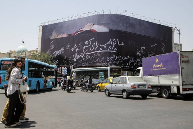 Giant billboard depicting Donald Trump hung in Tehran s Revolution Square TEHRAN, IRAN - JULY 15 : A view of a billboard depicting US President Donald Trump lying in a black coffin made of concrete barriers is hung at Enghelab (Revolution) Square with slogans written on the coffin walls , referring to the chalk-written barriers used at the ceremony for the late Iranian leader Ali Khamenei at the Imam Khomeini Musalla Mosque, on July 15, 2026 in Tehran, Iran. Fatemeh Bahrami Anadolu Tehran Iran. Editorial use only. Please get in touch for any other usage.  Copyright: x2026xAnadoluxFatemehxBahramix