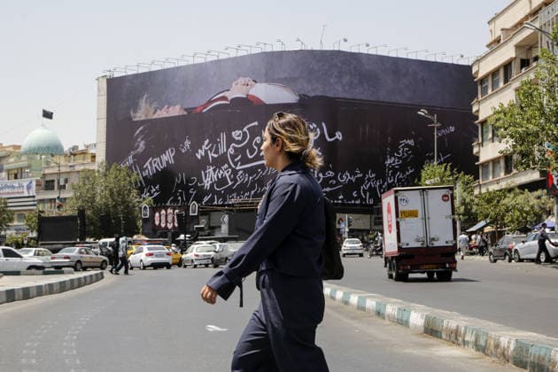 Giant billboard depicting Donald Trump hung in Tehran s Revolution Square TEHRAN, IRAN - JULY 15 : A view of a billboard depicting US President Donald Trump lying in a black coffin made of concrete barriers is hung at Enghelab (Revolution) Square with slogans written on the coffin walls , referring to the chalk-written barriers used at the ceremony for the late Iranian leader Ali Khamenei at the Imam Khomeini Musalla Mosque, on July 15, 2026 in Tehran, Iran. Fatemeh Bahrami Anadolu Tehran Iran. Editorial use only. Please get in touch for any other usage.  Copyright: x2026xAnadoluxFatemehxBahramix