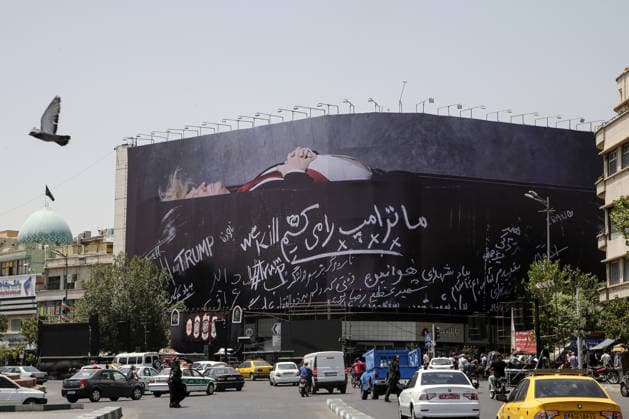 Giant billboard depicting Donald Trump hung in Tehran s Revolution Square TEHRAN, IRAN - JULY 15 : A view of a billboard depicting US President Donald Trump lying in a black coffin made of concrete barriers is hung at Enghelab (Revolution) Square with slogans written on the coffin walls , referring to the chalk-written barriers used at the ceremony for the late Iranian leader Ali Khamenei at the Imam Khomeini Musalla Mosque, on July 15, 2026 in Tehran, Iran. Fatemeh Bahrami Anadolu Tehran Iran. Editorial use only. Please get in touch for any other usage.  Copyright: x2026xAnadoluxFatemehxBahramix