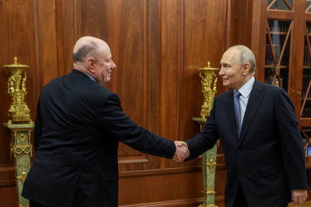 RUSSIA, MOSCOW - JULY 15, 2026: Vladimir Potanin (L), MMC Norilsk Nickel President, and Vladimir Putin, President of Russia, shake hands during a meeting at the Moscow Kremlin. Gavriil Grigorov Russian Presidential Press and Information Office TASS  95067832