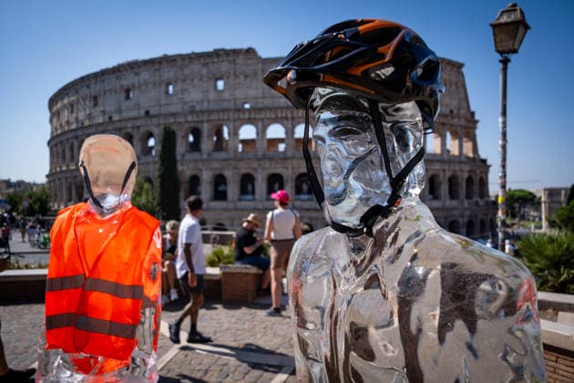 July 15, 2026, Rome, Rm, Italy: On the occasion of the European Day in remembrance of the victims of the global climate crisis, Greenpeace Italy activists let three ice statues melt in the sun near the Colosseum to denounce the impact of the climate crisis on workers. The statues depicted a farm worker, a construction worker, and a delivery driver, among the groups most exposed to heat waves. Rome Italy - ZUMAg256 20260715_znp_g256_004 Copyright: xMarcoxDixGianvitox