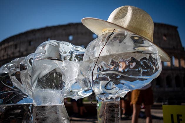 July 15, 2026, Rome, Rm, Italy: On the occasion of the European Day in remembrance of the victims of the global climate crisis, Greenpeace Italy activists let three ice statues melt in the sun near the Colosseum to denounce the impact of the climate crisis on workers. The statues depicted a farm worker, a construction worker, and a delivery driver, among the groups most exposed to heat waves. Rome Italy - ZUMAg256 20260715_znp_g256_003 Copyright: xMarcoxDixGianvitox