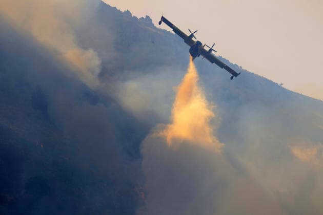 Italy battles extreme heat and wildfires PALERMO, ITALY - JULY 15: Firefighters battle the fire with firefighting aircraft and helicopters in an effort to bring it under control as a wildfire that broke out in the maquis vegetation on the slopes of Mount Longa spreading rapidly due to strong winds near Palermo, Sicily, Italy, on July 15, 2026. Alberto Lo Bianco Anadolu Palermo Italy. Editorial use only. Please get in touch for any other usage.  Copyright: x2026xAnadoluxAlbertoxLoxBiancox