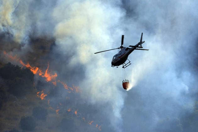 Italy battles extreme heat and wildfires PALERMO, ITALY - JULY 15: Firefighters battle the fire with firefighting aircraft and helicopters in an effort to bring it under control as a wildfire that broke out in the maquis vegetation on the slopes of Mount Longa spreading rapidly due to strong winds near Palermo, Sicily, Italy, on July 15, 2026. Alberto Lo Bianco Anadolu Palermo Italy. Editorial use only. Please get in touch for any other usage.  Copyright: x2026xAnadoluxAlbertoxLoxBiancox